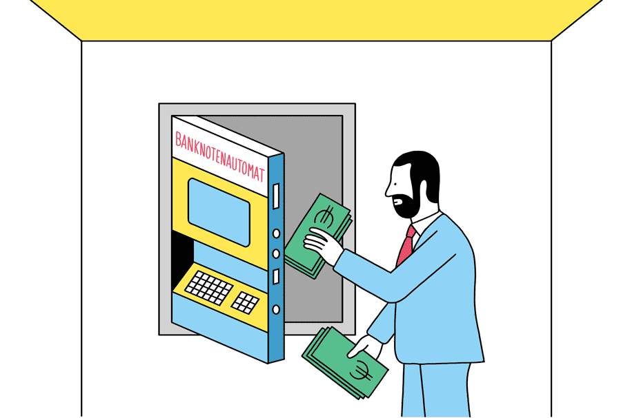 Mann befüllt Geldautomaten