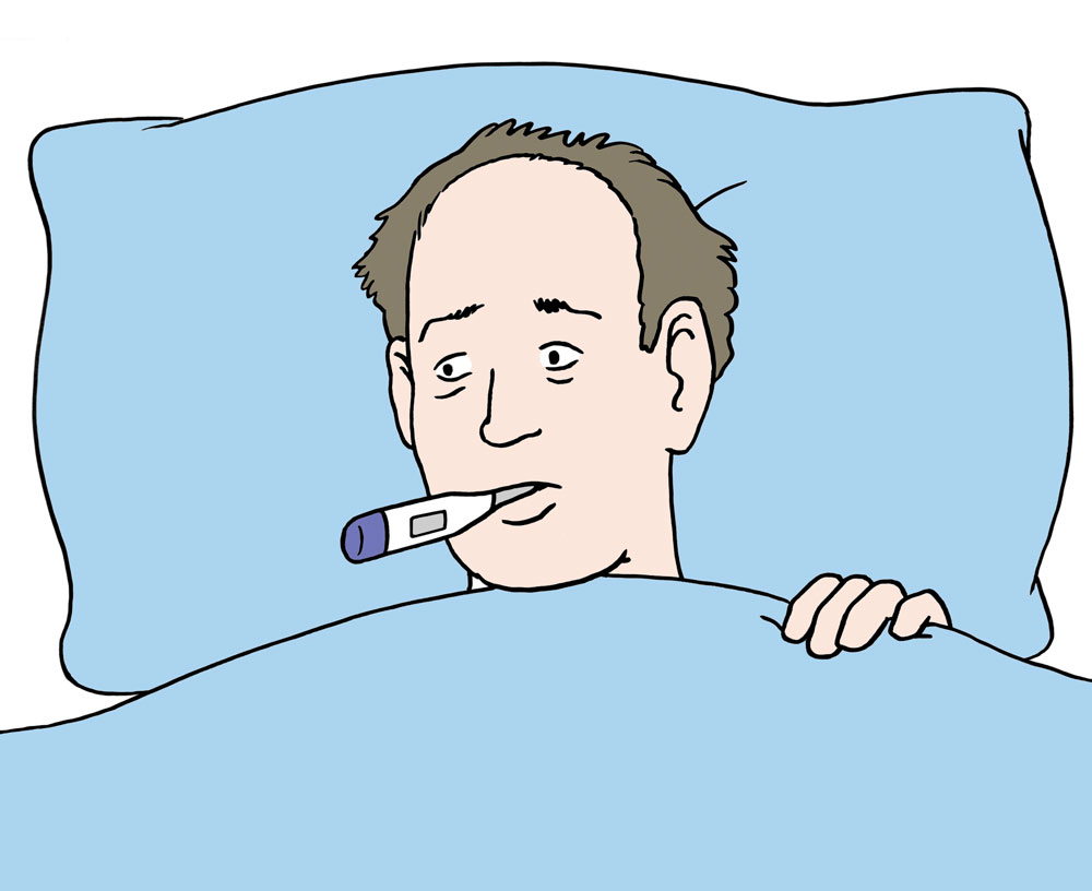Mann liegt mit Fieber im Bett