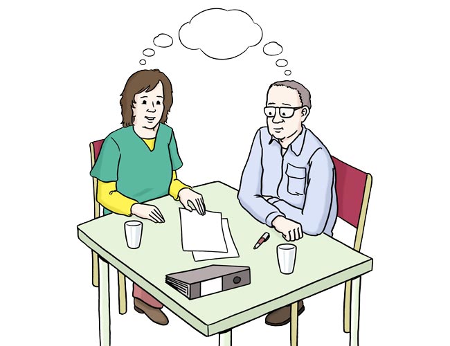 Frau und Mann denken an einem Tisch nach